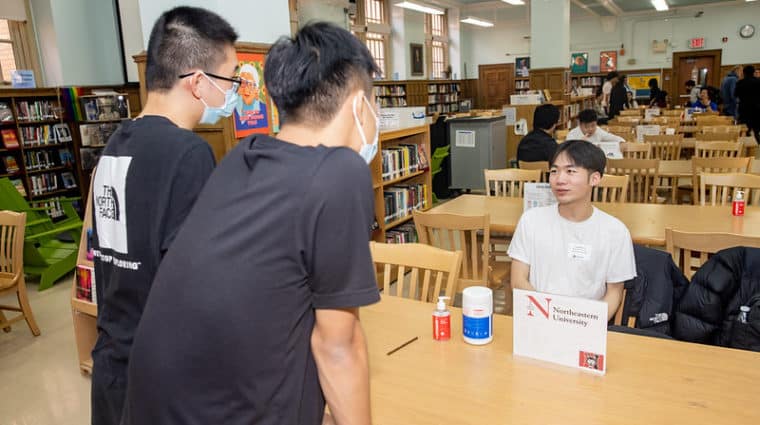 Alumni with students